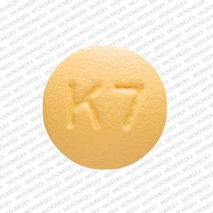 Enter the imprint code that appears on the pill. . Round yellow pill k7